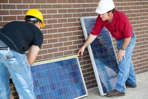 Electricians-measuring-solar-panels-they-are-about-to-install