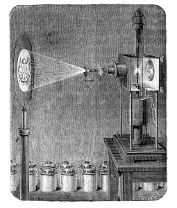 Original wood engraving from L'?lectricit? by J. Baille, Paris - Hachette 1868. One of the first microscope based on the photoelectric effect, phenomenon in which electrons are emitted from matter after energy absorption from electromagnetic radiation